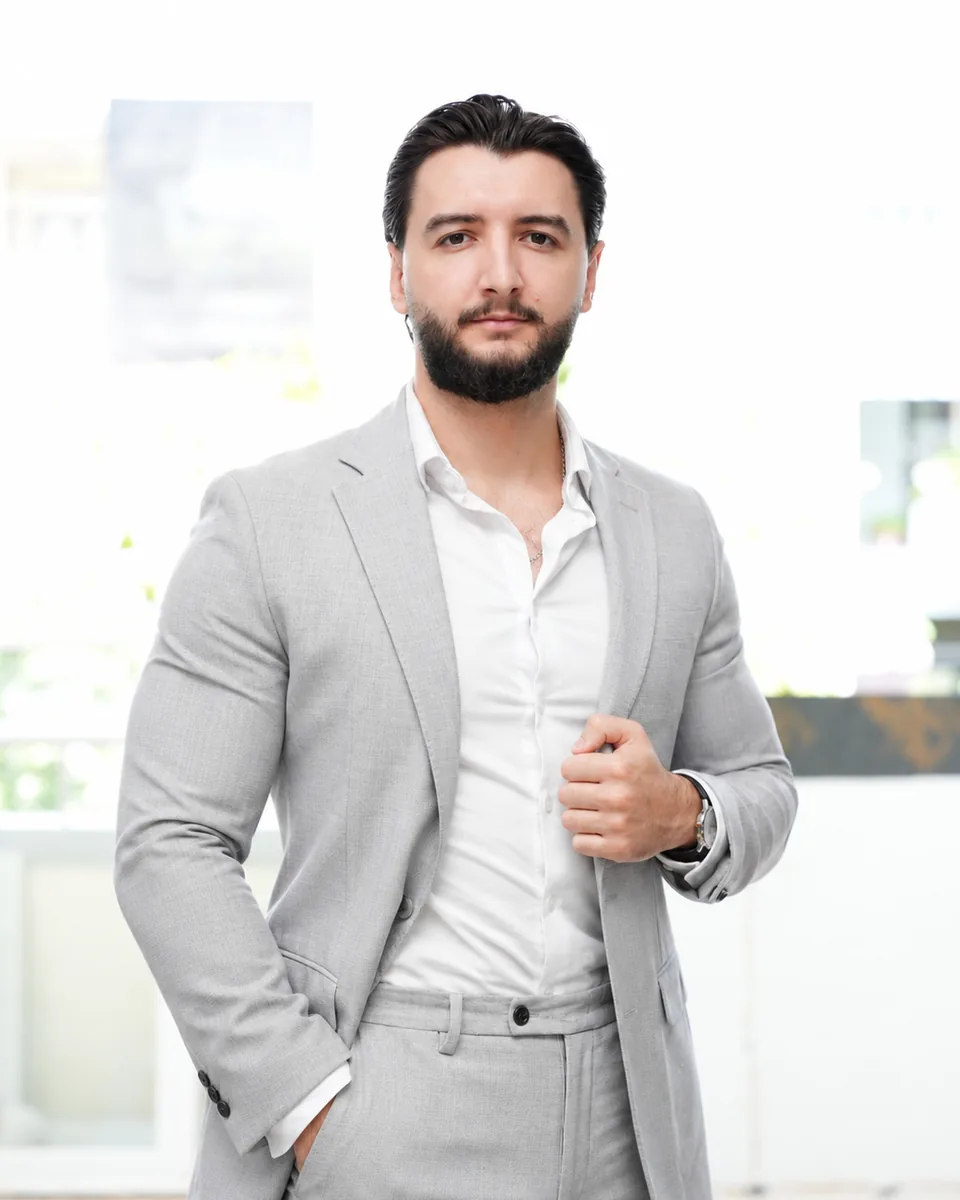 Gabriel, founder of Archive Dividend, in a light grey suit
